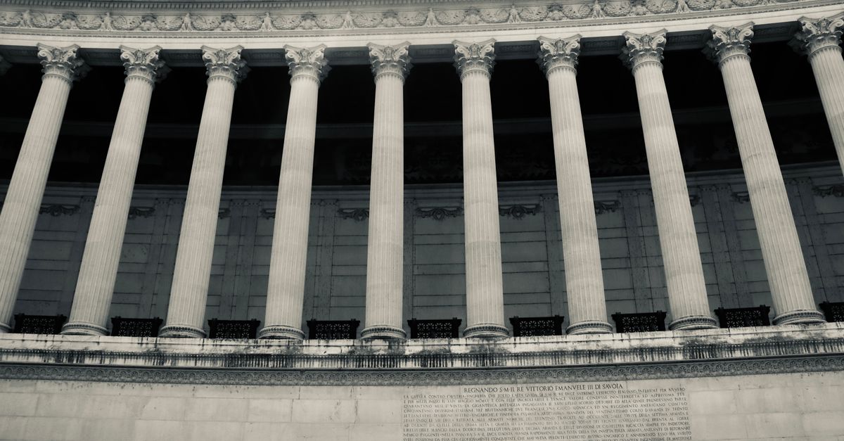Detailed view of neoclassical columns in a government building facade.